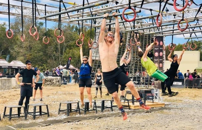 group of athletes competing in obstacle course