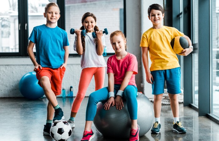 group of kids with sports equipment